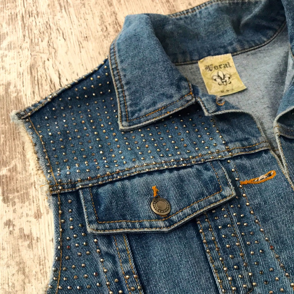 Silver rhinestone encrusted denim vest.
